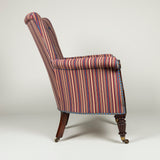 A George IV library armchair with a high back and carved mahogany lyre front. Circa 1830.