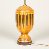 A turned wood urn decorated with geometric marquetry, early 20th century, wired as a lamp.