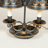 A late 19th century painted tole two candle student’s lamp, now wired for electricity.