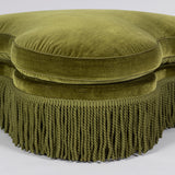 A late 19th or early 20th century trefoil ottoman, re-upholstered in green velvet.