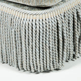 A large rectangular Ottoman, upholstered in grey/blue gauffraged velvet with bullion fringe. Modern.