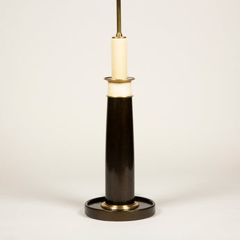 A mid-20th century French column lamp on a wide round base covered in bronze coloured leather, rewired.