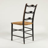 A George III painted side chair with arched ladder back and rush seat. Circa 1780,  original decoration.