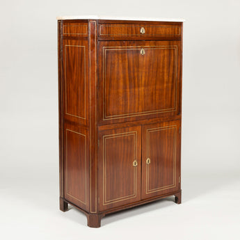 A Directoire period mahogany fall-front bureau with marble top. French, circa 1800. Featured in the Hunting Lodge.