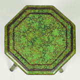 A small octagonal green kashmiri table..