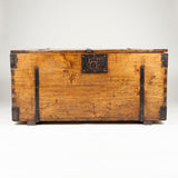 A large early 20th century softwood coffer with wrought iron strap hinges and lock, probably Italian.