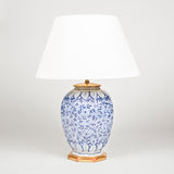 A pair of early 20th century blue and white Delft facetted ovoid vases, converted to lamps..