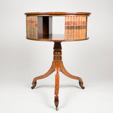 A small mahogany drum table with revolving book case top and tripod base. Circa 1800, a lovely golden colour.