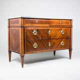 A late 18th century Italian parquetry commode, the front book-match veneered in exotic hardwood with two short over two long drawers, circa 1790.