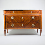A late 18th century Italian parquetry commode, the front book-match veneered in exotic hardwood with two short over two long drawers, circa 1790.